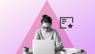 Black and white image of a woman is sitting at her desk. She is smiling and working on her laptop. Against a pink colored background. Header image for document signing.